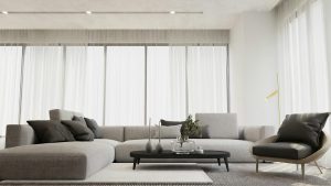 Bright et élégant intérieur de salon moderne mettant en valeur un canapé gris chic et une table basse épurée.